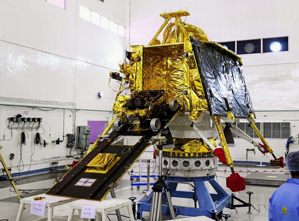 Scientists in Bangalore work on the orbiter vehicle of India's first moon lander and rover mission