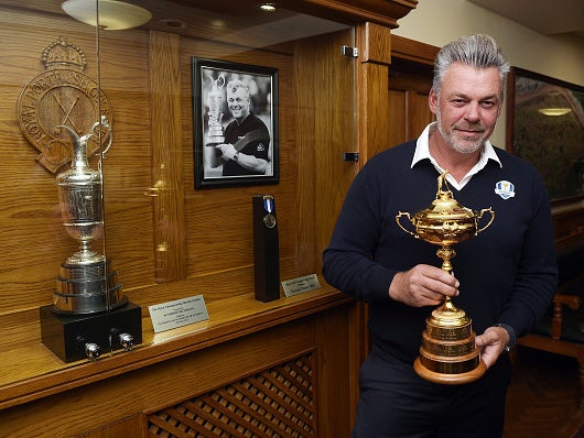 Darren Clarke poses with the Ryder Cup beside his own Claret Jug at Portrush