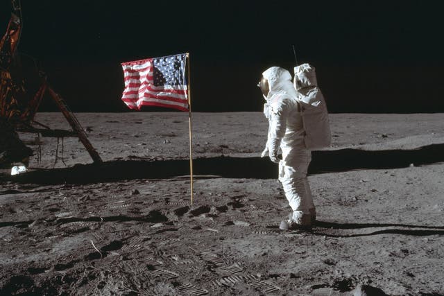 In this July 20, 1969 photo made available by NASA, astronaut Buzz Aldrin Jr. poses for a photograph beside the U.S. flag on the moon during the Apollo 11 mission