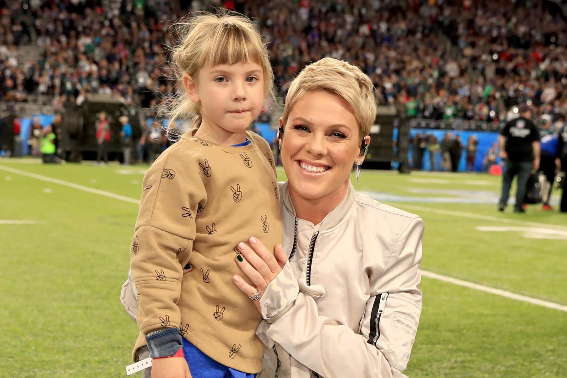 Recording artist Pink (R) poses with daughter Willow Sage Hart before the National Anthem during the Super Bowl LII Pregame show at U.S. Bank Stadium on February 4, 2018 in Minneapolis, Minnesota.