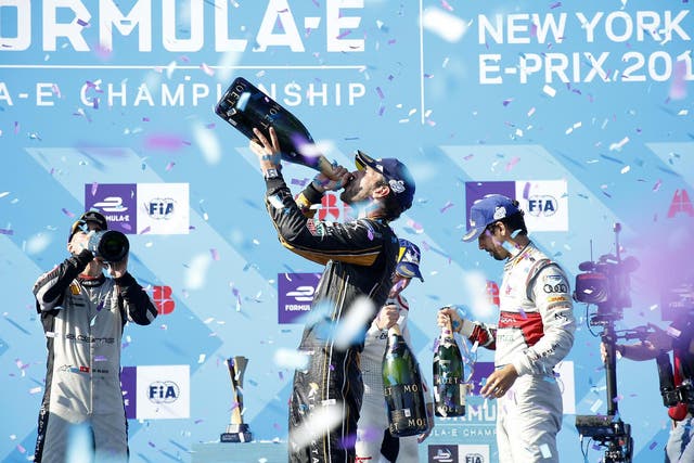 Jean-Eric Vergne celebrates his title victory on the podium in New York
