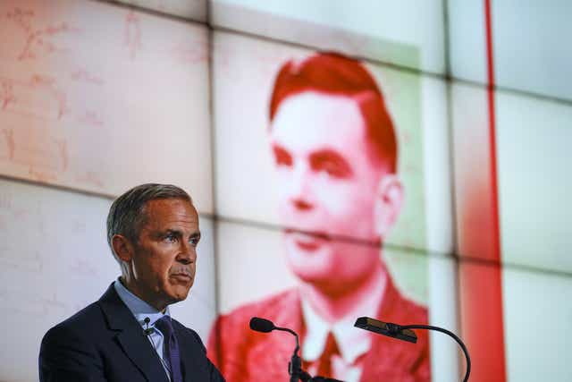 The Governor of the Bank of England, Mark Carney reveals Alan Turing as the new figure to be depicted on the 50 GBP note at the Manchester Science and Industry Museum on July 15, 2019 in Manchester, England