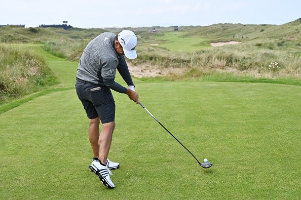 Xander Schauffele tees off during a practice round at Portrush