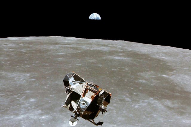 The Apollo 11 Lunar Module ascent stage, with astronauts Neil A. Armstrong and Edwin E. Aldrin Jr. aboard, is photographed from the Command and Service Modules in lunar orbit, July 20, 1969