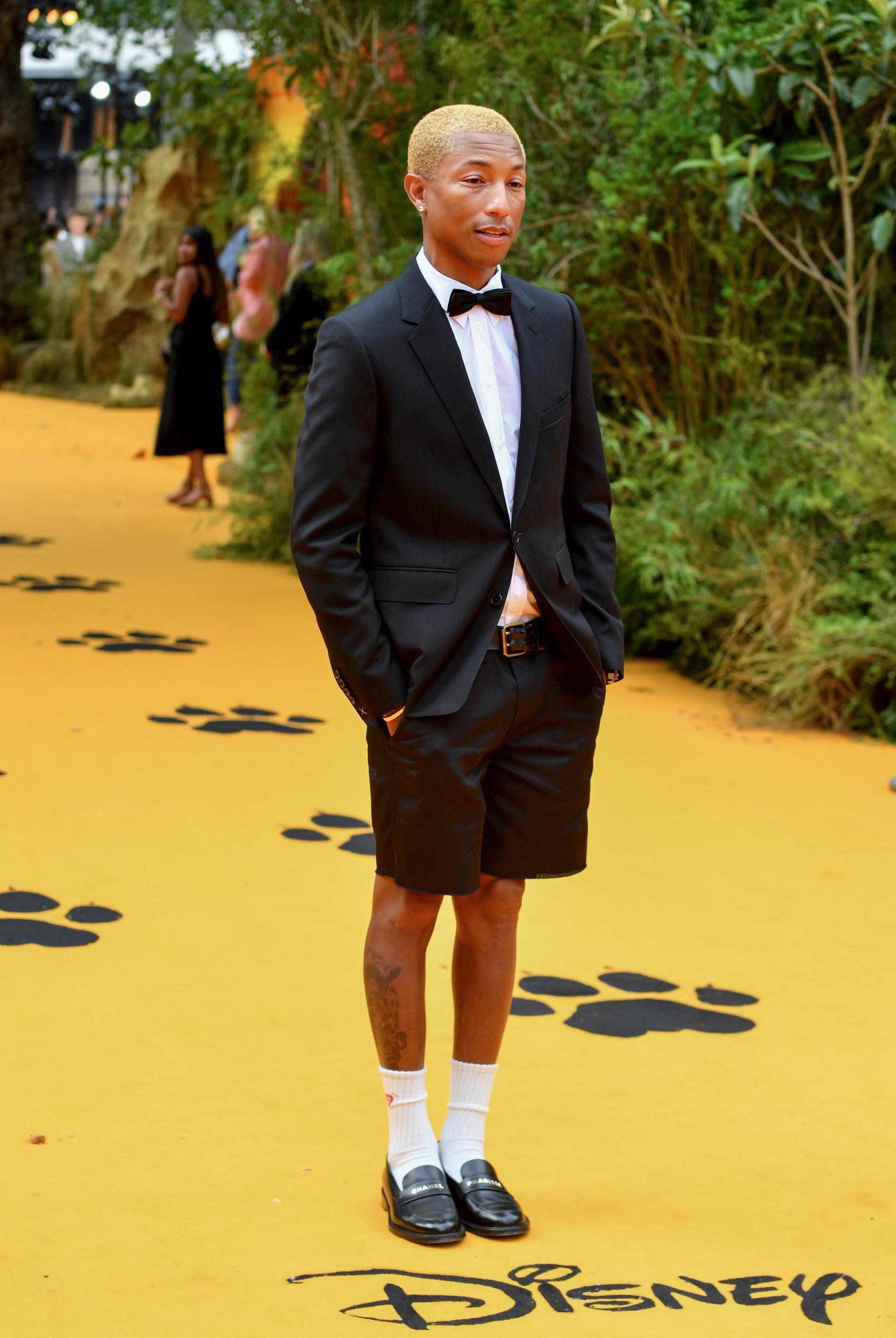 Pharrell keeps pushing fashion barriers with outlandish style. The Chanel muse is renowned for his Hawaiian T-shirts and, as shown here, his innovative twist on traditional tailoring, which he wore to the London premiere of <i>The Lion King</i>. Few could pull off suit shorts quite like Pharrell.