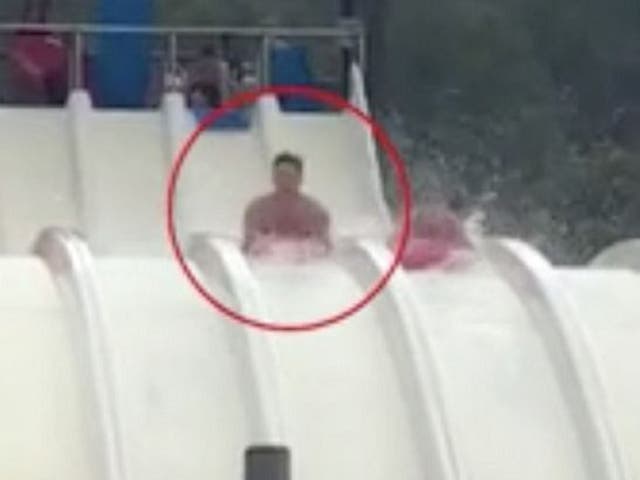 Still image taken from a video of David Briffaut, 23, and girlfriend Penny Bristow travelling down the Splash waterslide at Aqualandia, in Benidorm.