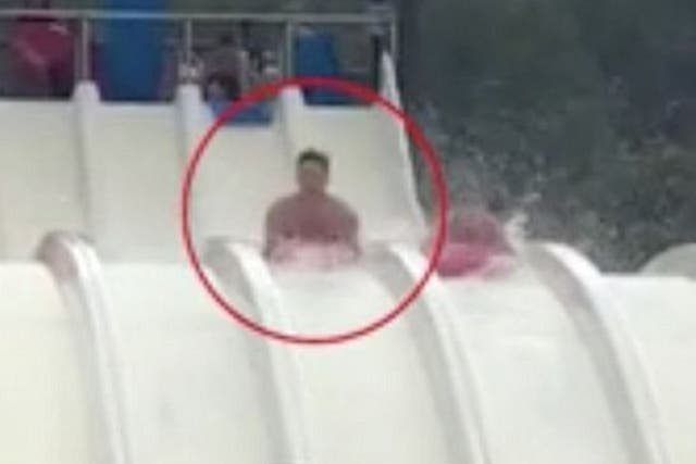 Still image taken from a video of David Briffaut, 23, and girlfriend Penny Bristow travelling down the Splash waterslide at Aqualandia, in Benidorm.