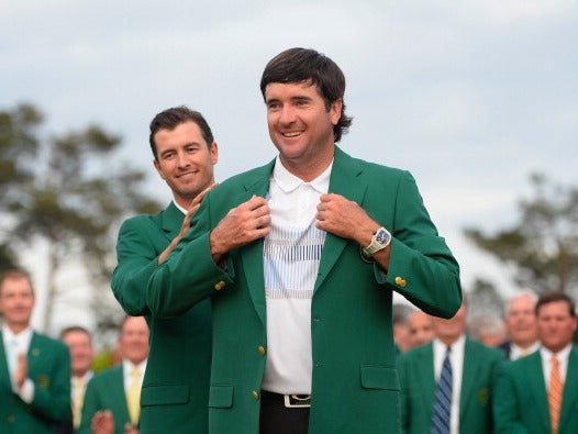 Bubba Watson receives the Green Jacket after winning the Masters again in 2014
