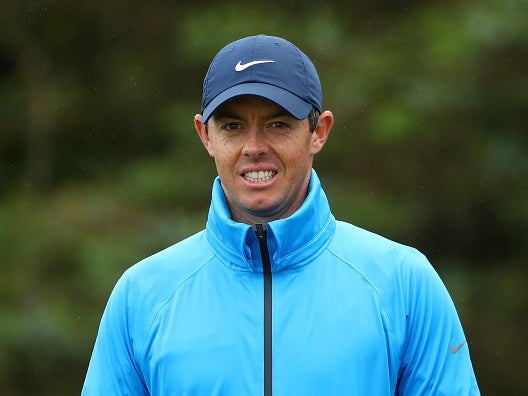 Rory McIlroy braves the weather during a practice round at Portrush