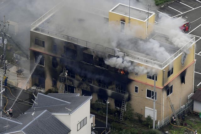 Firefighters battle a fire at the Kyoto Animation Company studio building in Japan on 18 July 2019.