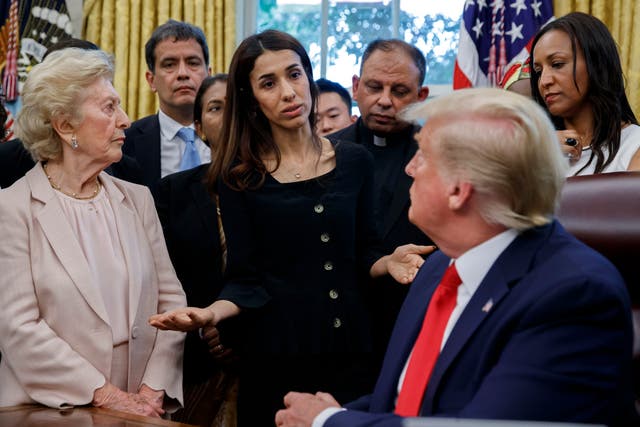 President Donald Trump listens to Nobel Peace Prize winner Nadia Murad