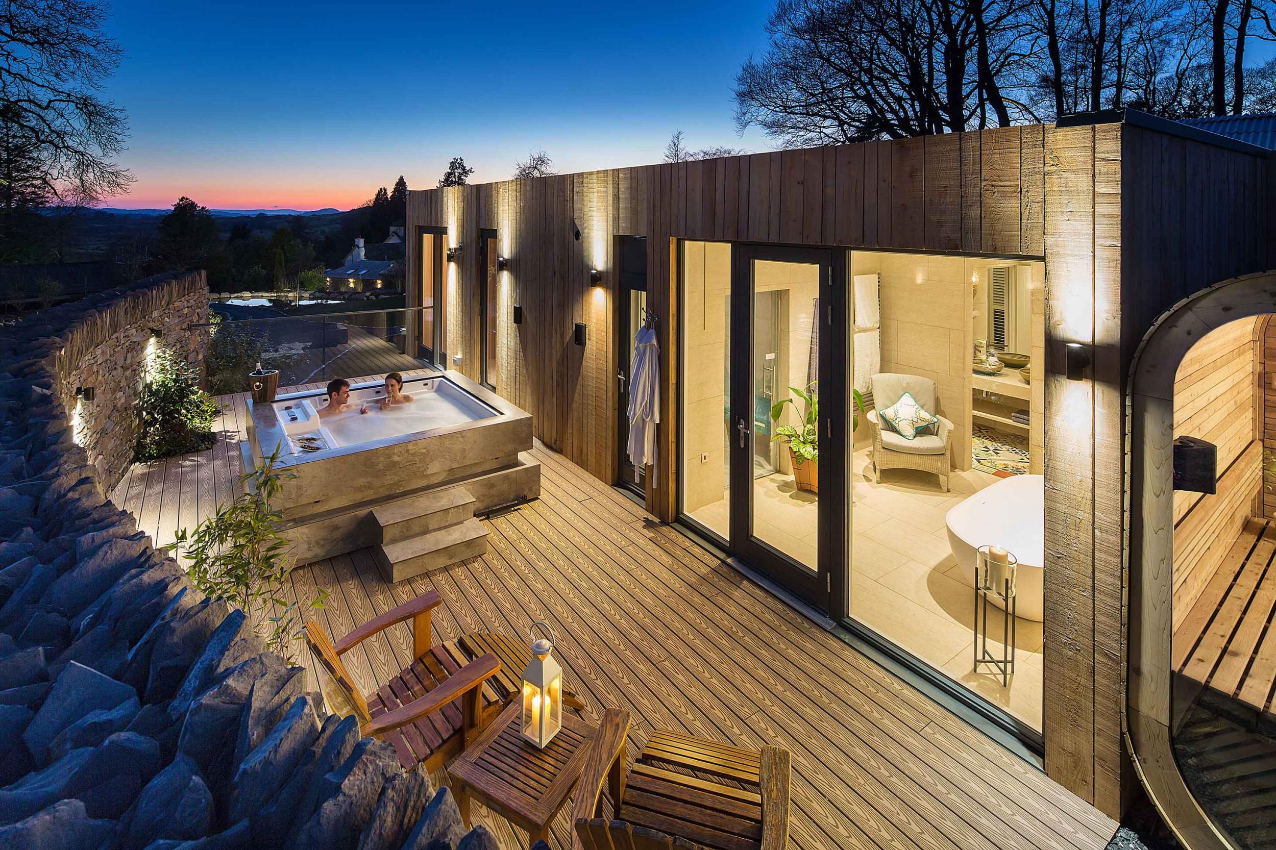 A hot tub sauna lodge, surrounded by a walled garden, at Gilpin Hotel
