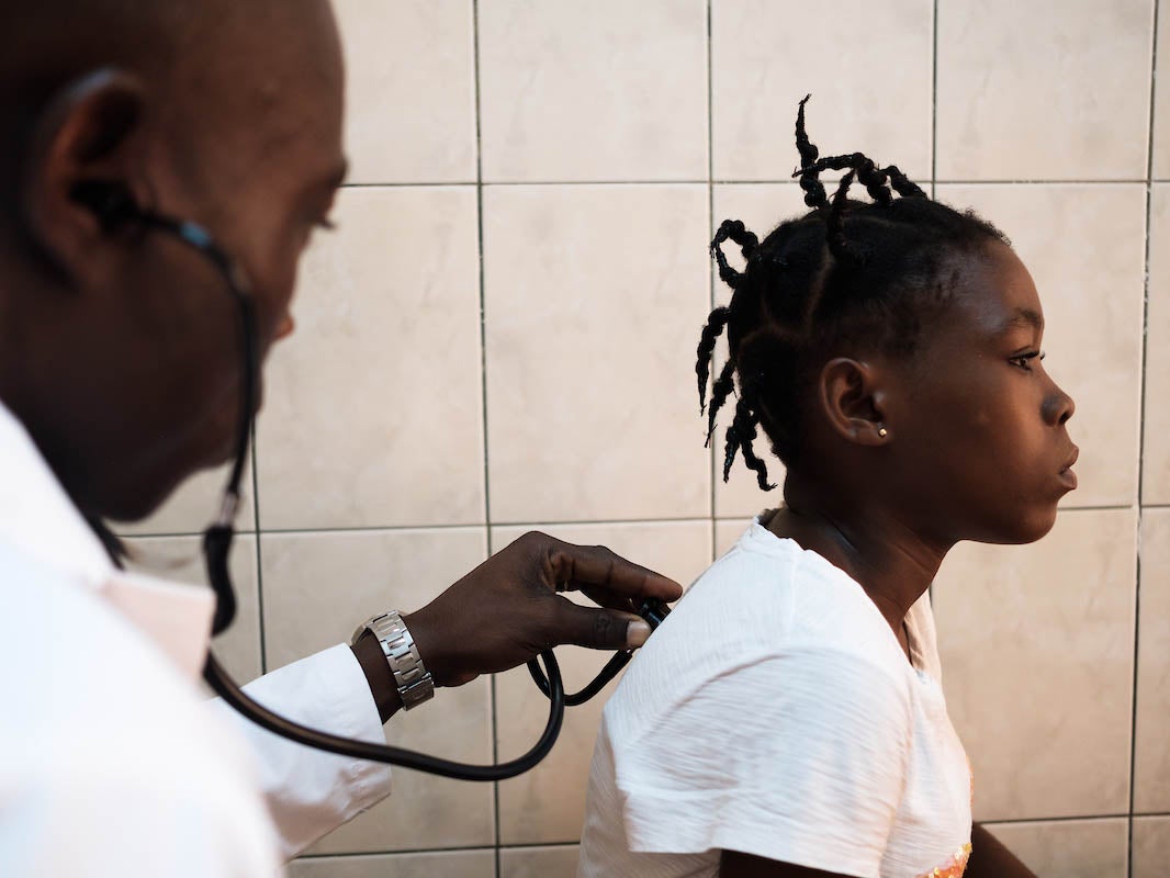 Jennifer, 17, who has sickle-cell disease, with Dr Hèzouwè Magnang. She is having a consultation for a vaso-occlusive crisis – an episode of severe pain – at the National Sickle Cell Research and Care Centre in Lomé