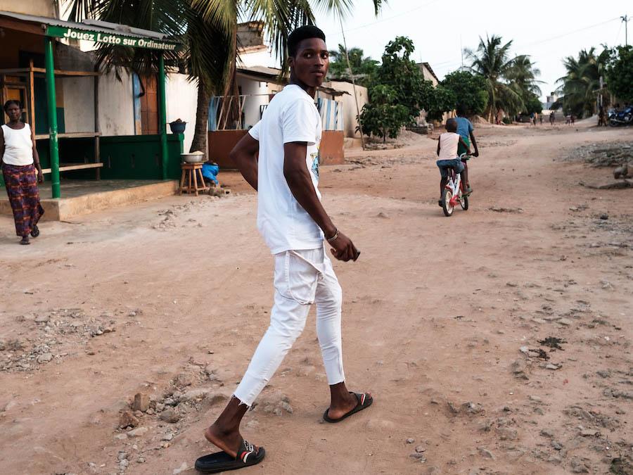 "Ayao", 15, a tramadol addict, walks around his neighbourhood in Togo while high on the opiod and cannabis