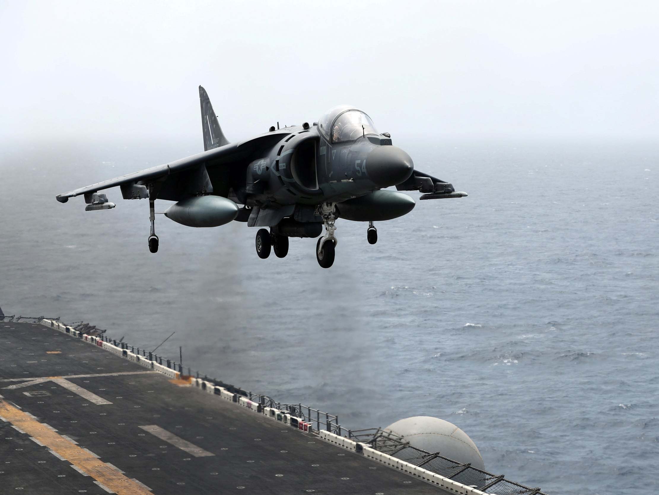 A US Harrier aircraft lands on the flight deck of USS Boxer in the Arabian Sea off Oman July 17, 2019