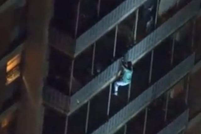 A man scaled down the side of 19-story high rise building to escape from a fire that injured seven