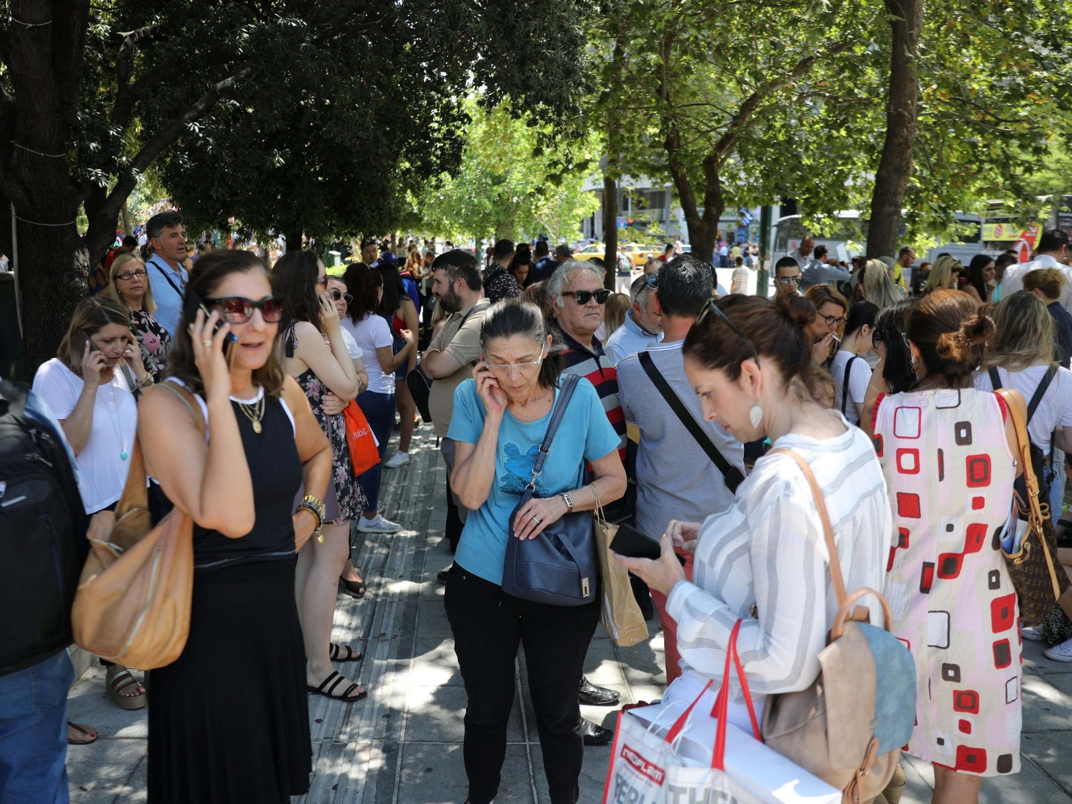 People are seen on the Syntagma Square following the evacuation of nearby buildings after an earthquake in Athens