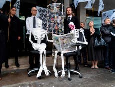 Extinction rebellions activists stage die-in outside newspaper offices