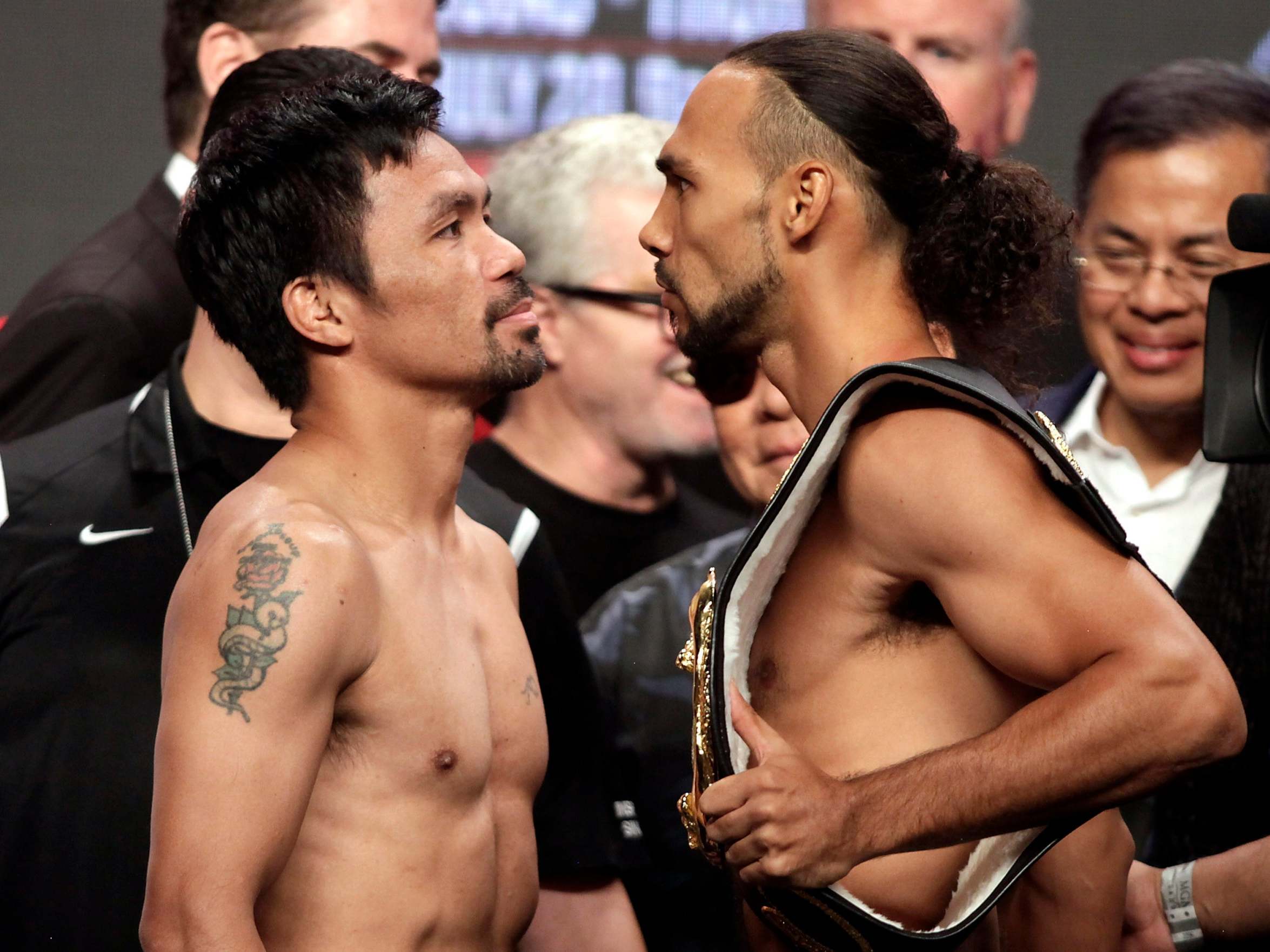 Manny Pacquiao and Keith Thurman fight for the WBA super welterweight world title