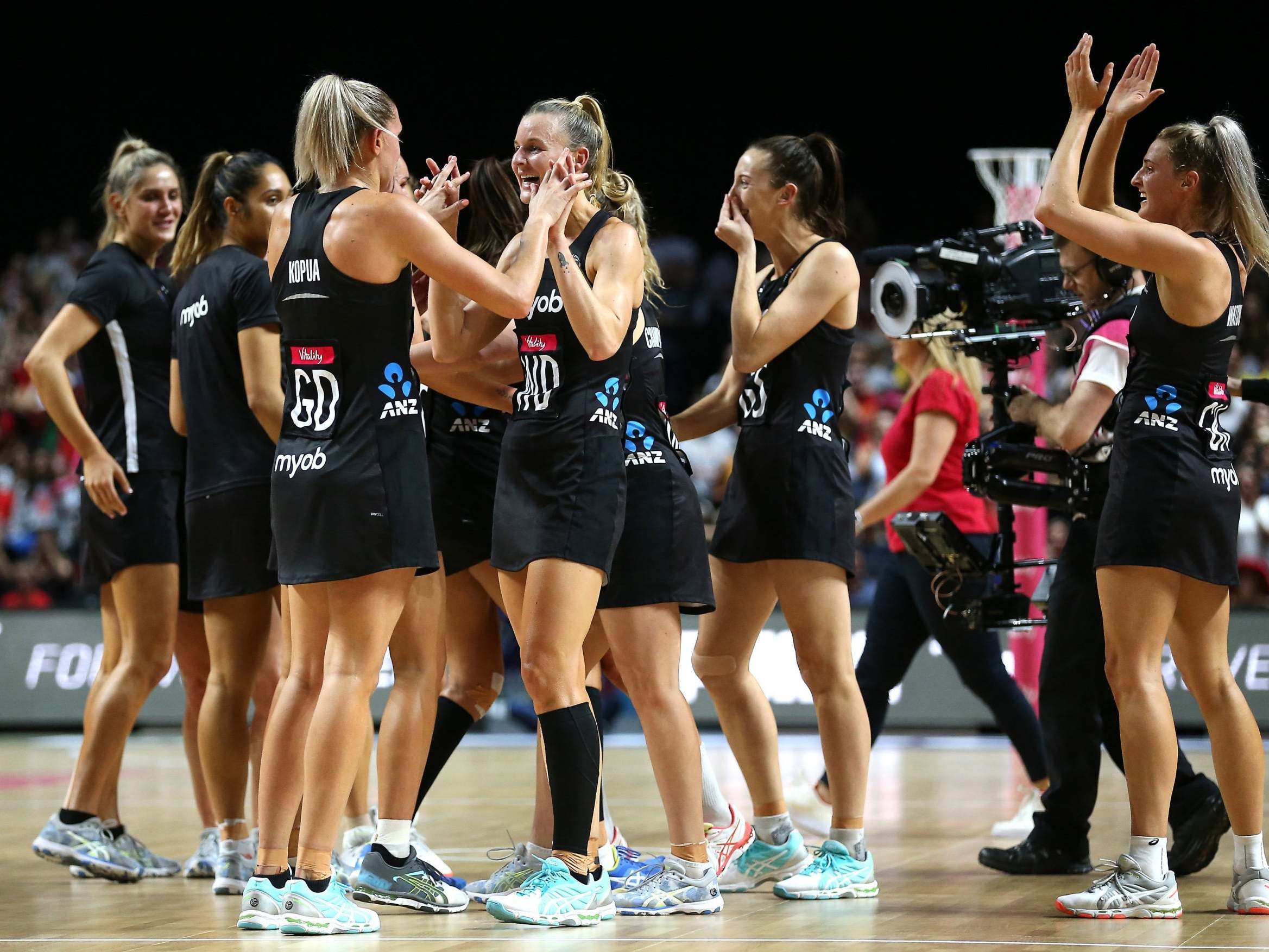 New Zealand players celebrate after their victory against England