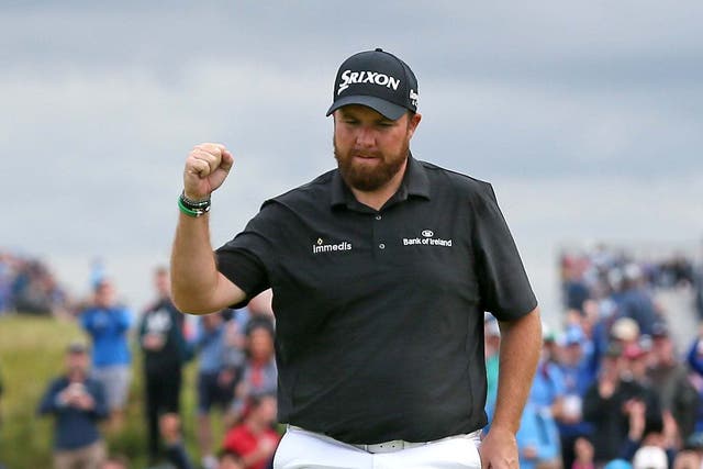 Shane Lowry celebrates a birdie at the 15th