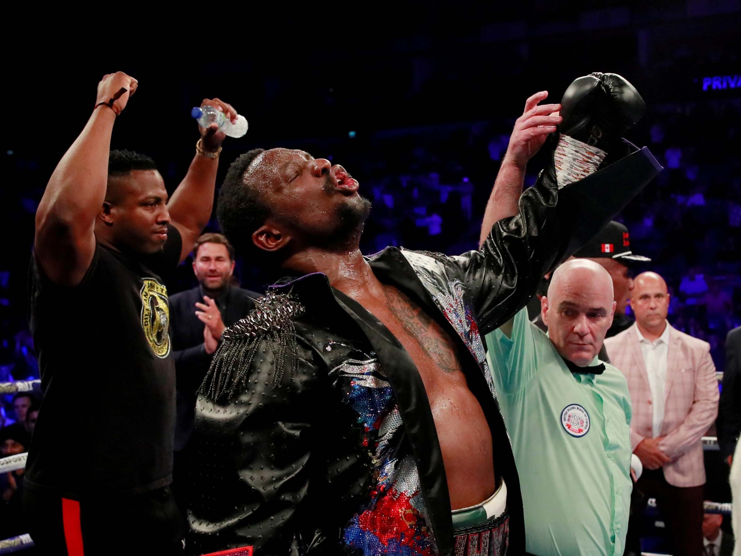 Dillian Whyte celebrates defeating Oscar Rivas by unanimous decision