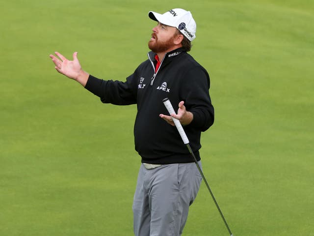 JB Holmes reacts to a triple-bogey on the 11th hole during a nightmare final round at The Open