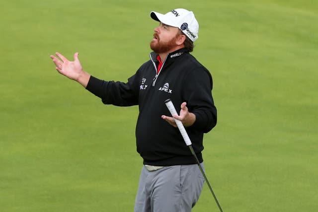 JB Holmes reacts to a triple-bogey on the 11th hole during a nightmare final round at The Open