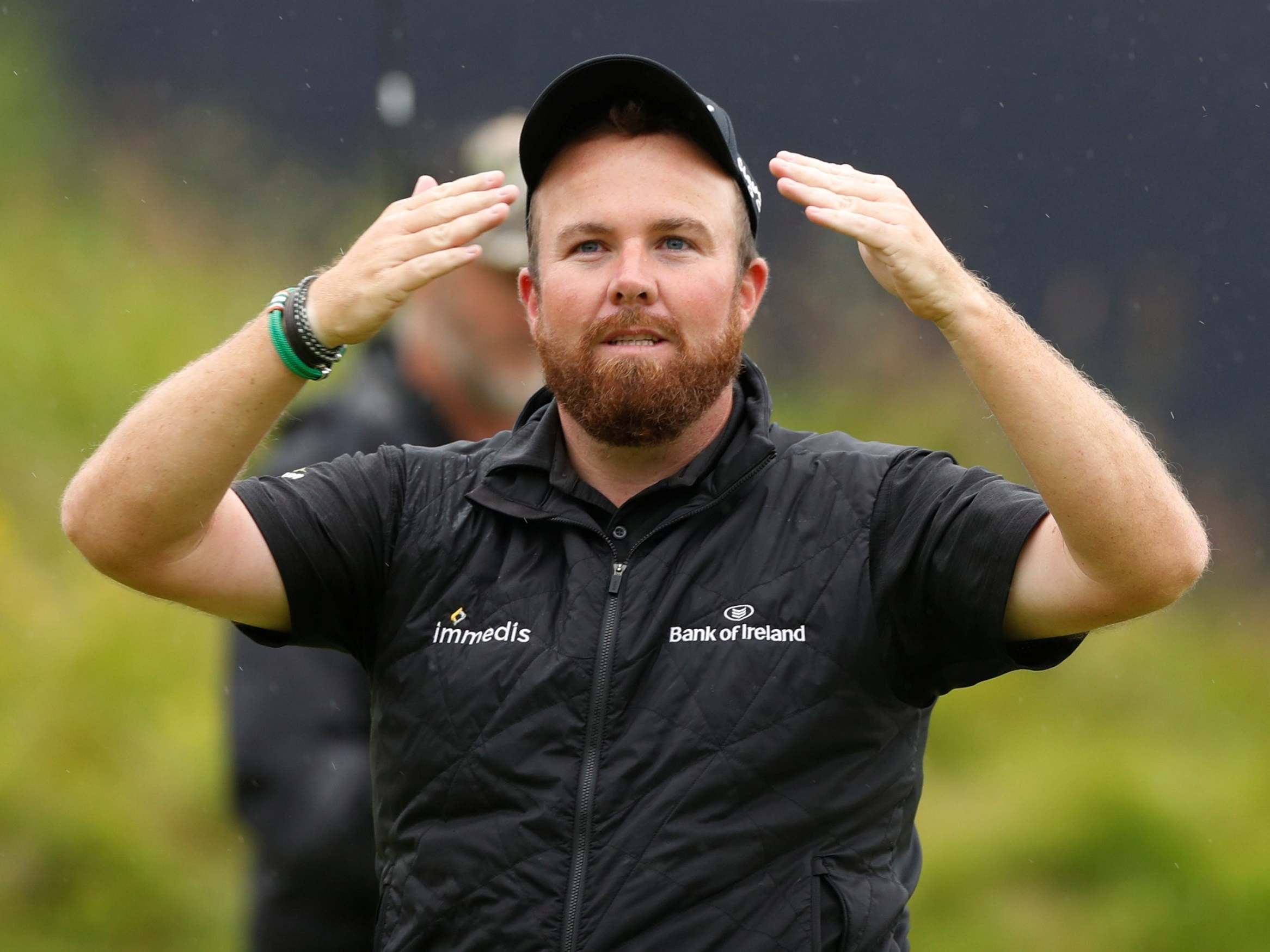 Shane Lowry soaks up the celebrations on the 18th after winning The Open