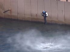 Man in jetpack flies across Sydney Harbour