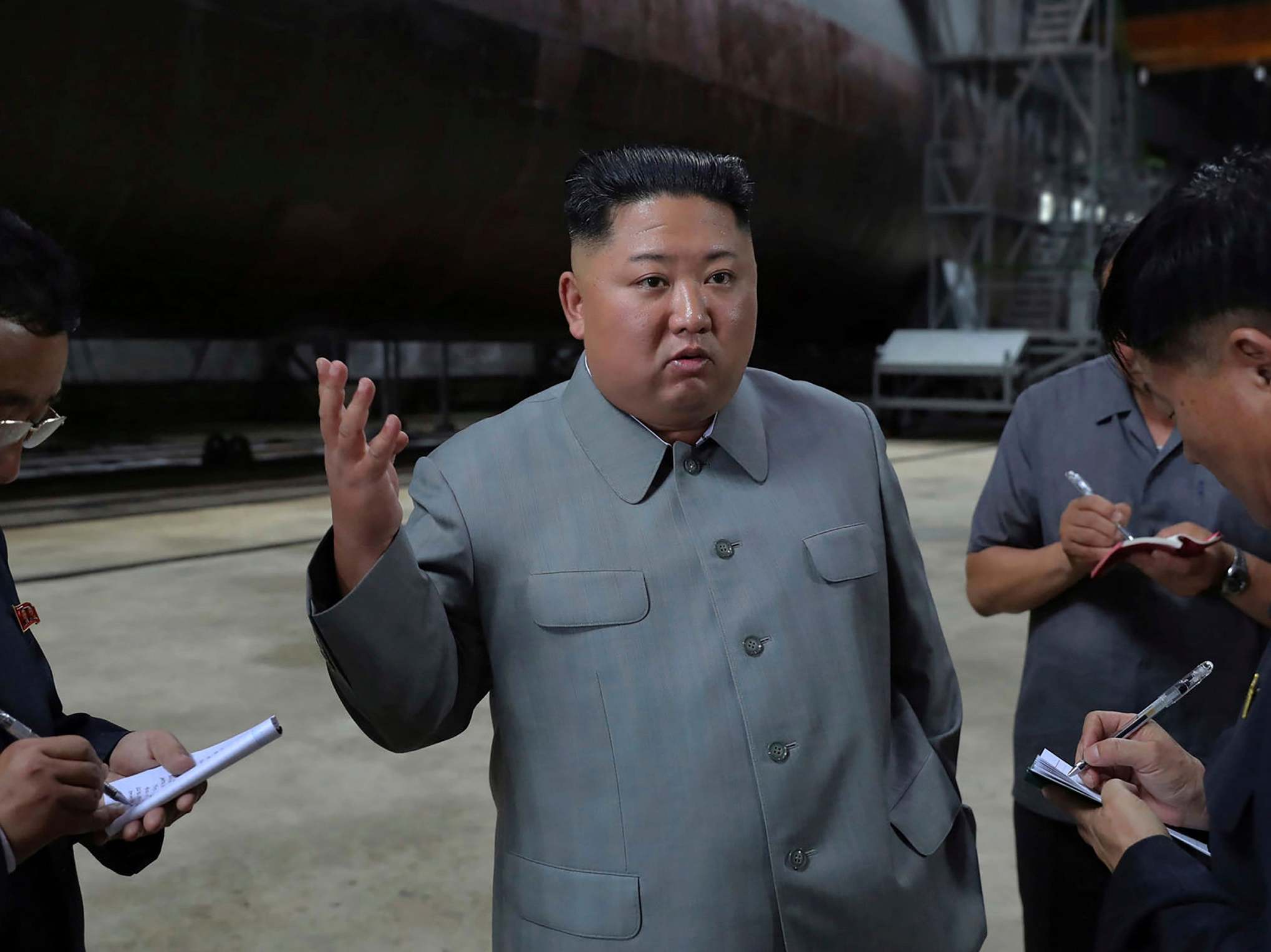 Kim Jong-un speaks while inspecting newly built submarine