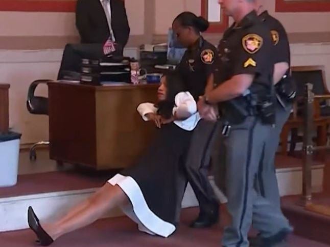 Tracie Hunter was dragged from the courtroom following the hearing