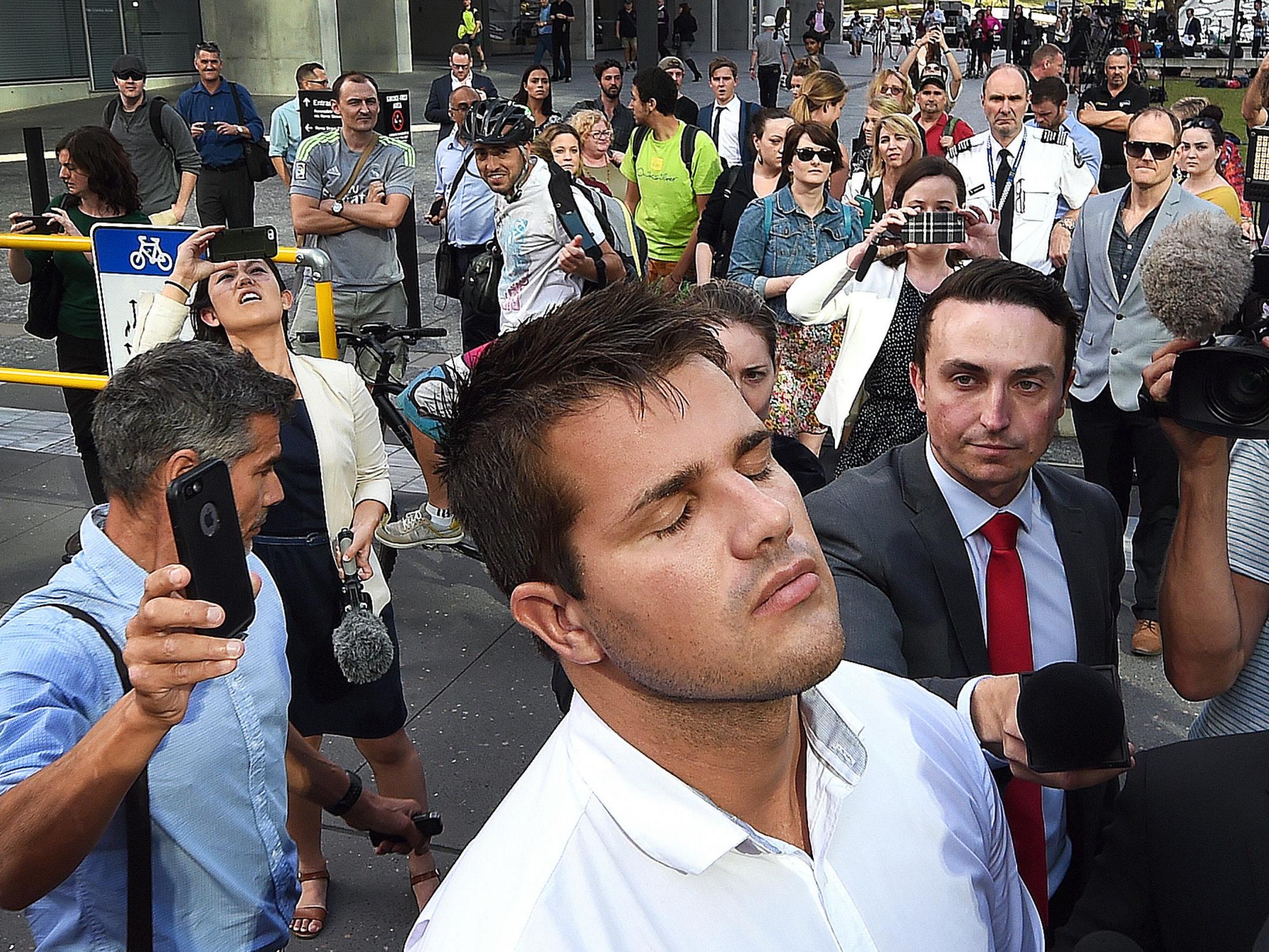 Gable Tostee leaves court in Australia after being found not guilty of killing Warriena Wright, whom he met on Tinder