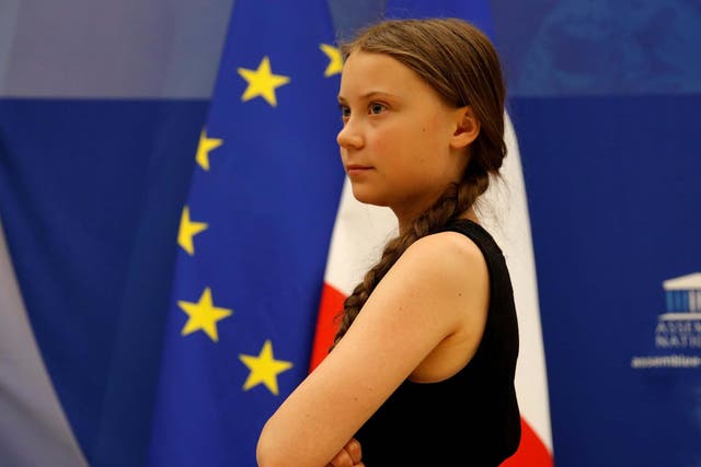 Swedish environmental activist Greta Thunberg leaves after a debate with French parliament members at the National Assembly in Paris