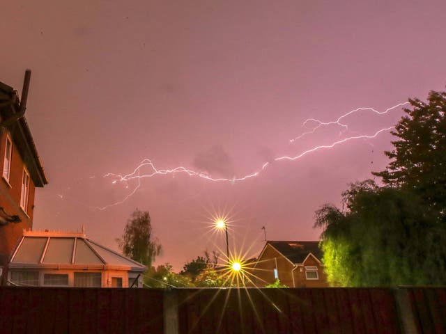 Lightning strikes as a thunderstorm passes over houses in Lee Park, Liverpool, Merseyside on 24 July 2019.