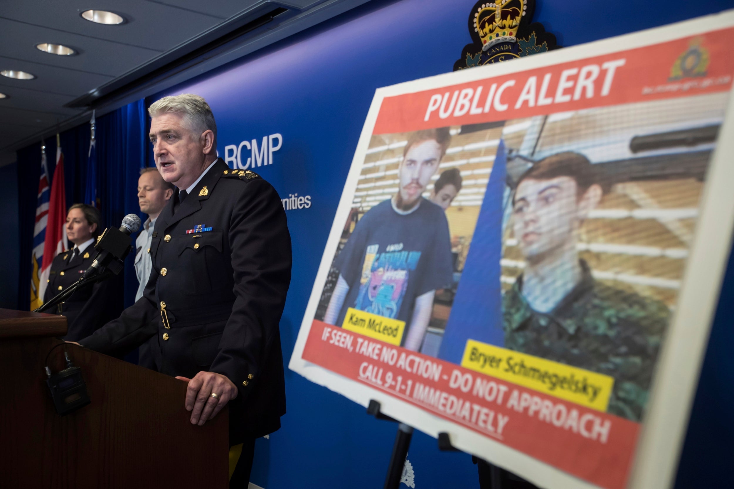 Security camera images recorded in Saskatchewan are displayed as RCMP assistant commissioner Kevin Hackett speaks at news conference in Surrey, British Columbia