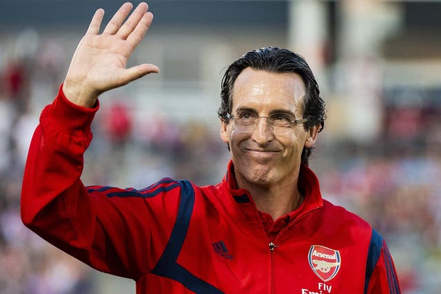Arsenal manager Unai Emery waves to fans