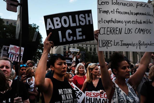 <p>Hundreds of people gather in lower Manhattan for a ‘Lights for Liberty’ protest against migrant detention camps and impending raids by Immigration and Customs Enforcement in various cities on 12 July 12 2019</p>