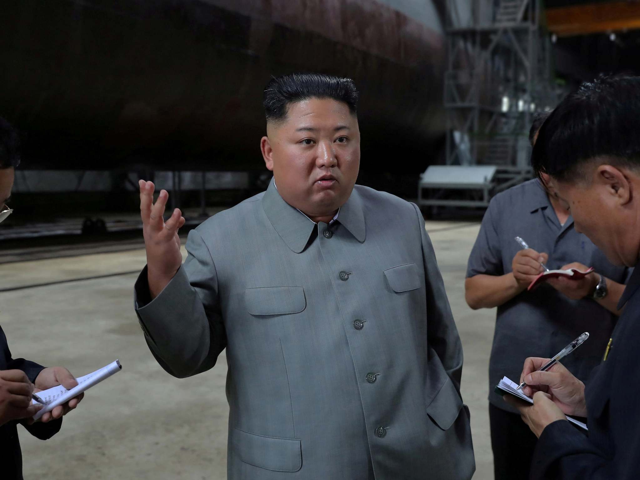 Kim Jong-un inspects a submarine factory at an undisclosed location in North Korea