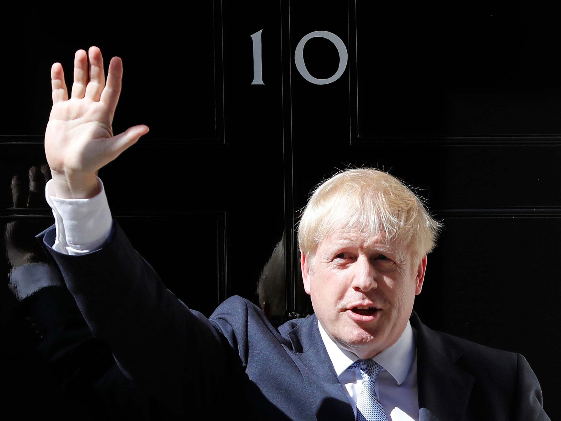 Boris Johnson waves from the steps outside 10 Downing Street at Downing Street