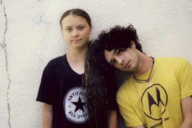Greta Thunberg, left, with Matty Healy of The 1975