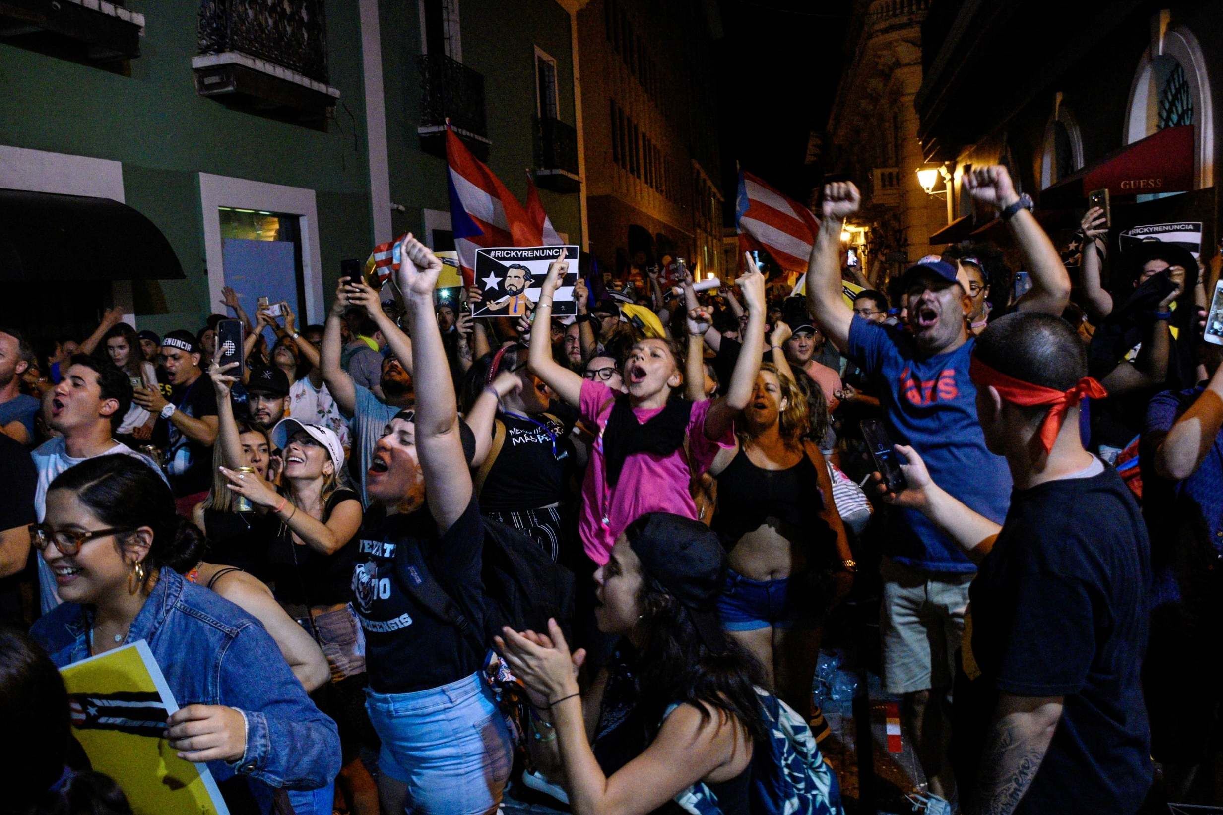 Demonstrators celebrate in San Juan after the resignation of Puerto Rico governor Ricardo Rossello