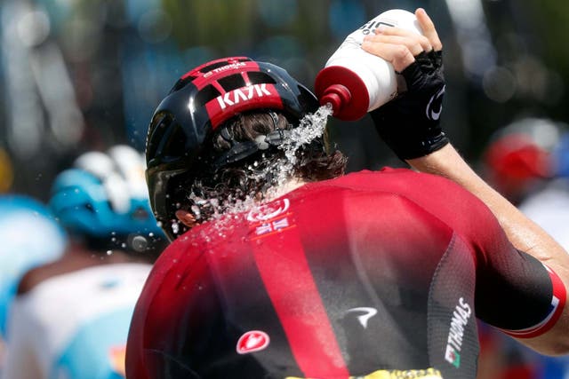 Britain's Geraint Thomas pours water onto his neck