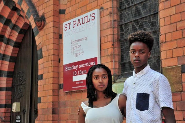 Vanylson Silva, 14, outside St Paul's Church, in Worcester, with his mother Vanessa Santos. Vanylson was arrested by police officers as he entered the church on Sunday, 21 July 2019.