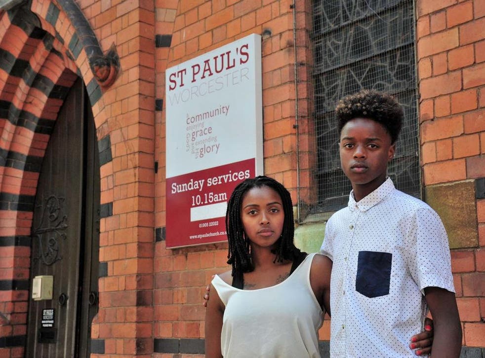 Vanylson Silva, 14, outside St Paul's Church, in Worcester, with his mother Vanessa Santos. Vanylson was arrested by police officers as he entered the church on Sunday, 21 July 2019.