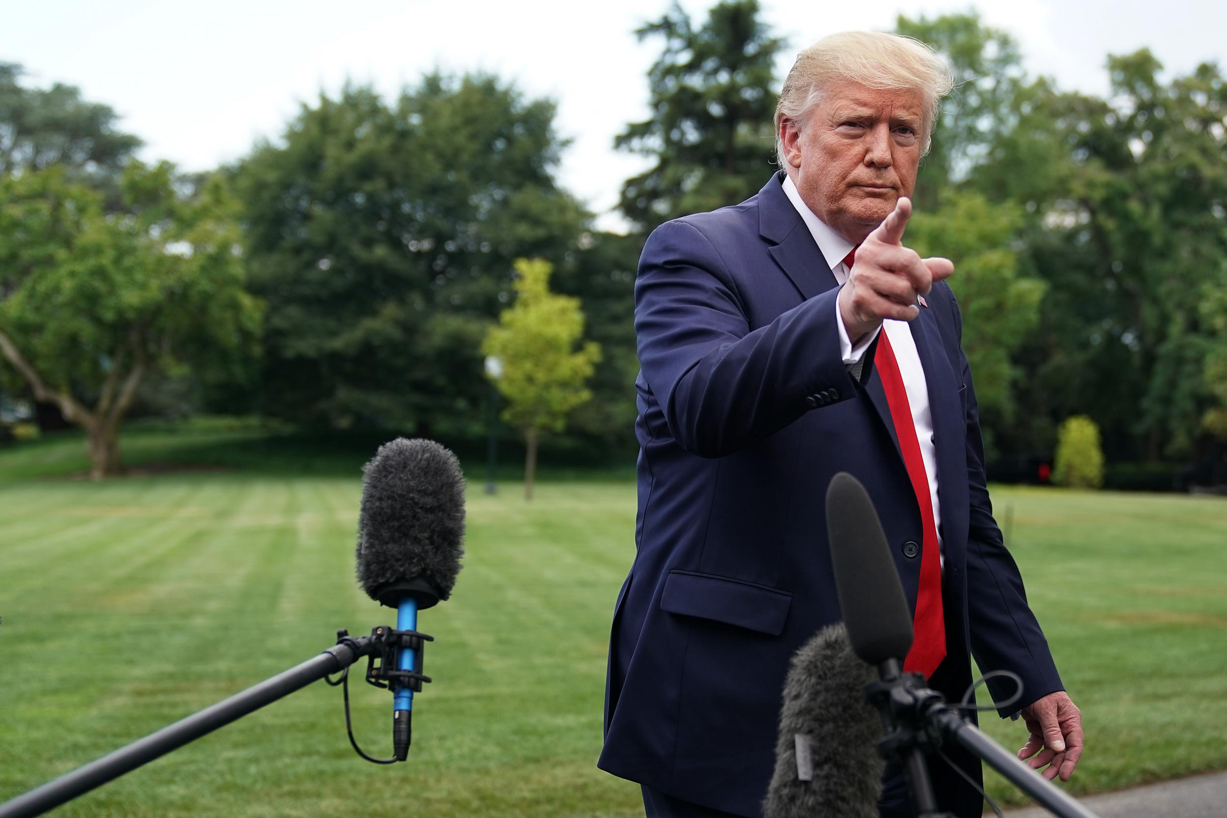 Donald Trump talks to reporters as he departs the White House for a campaign rally July 17, 2019 in Washington, DC