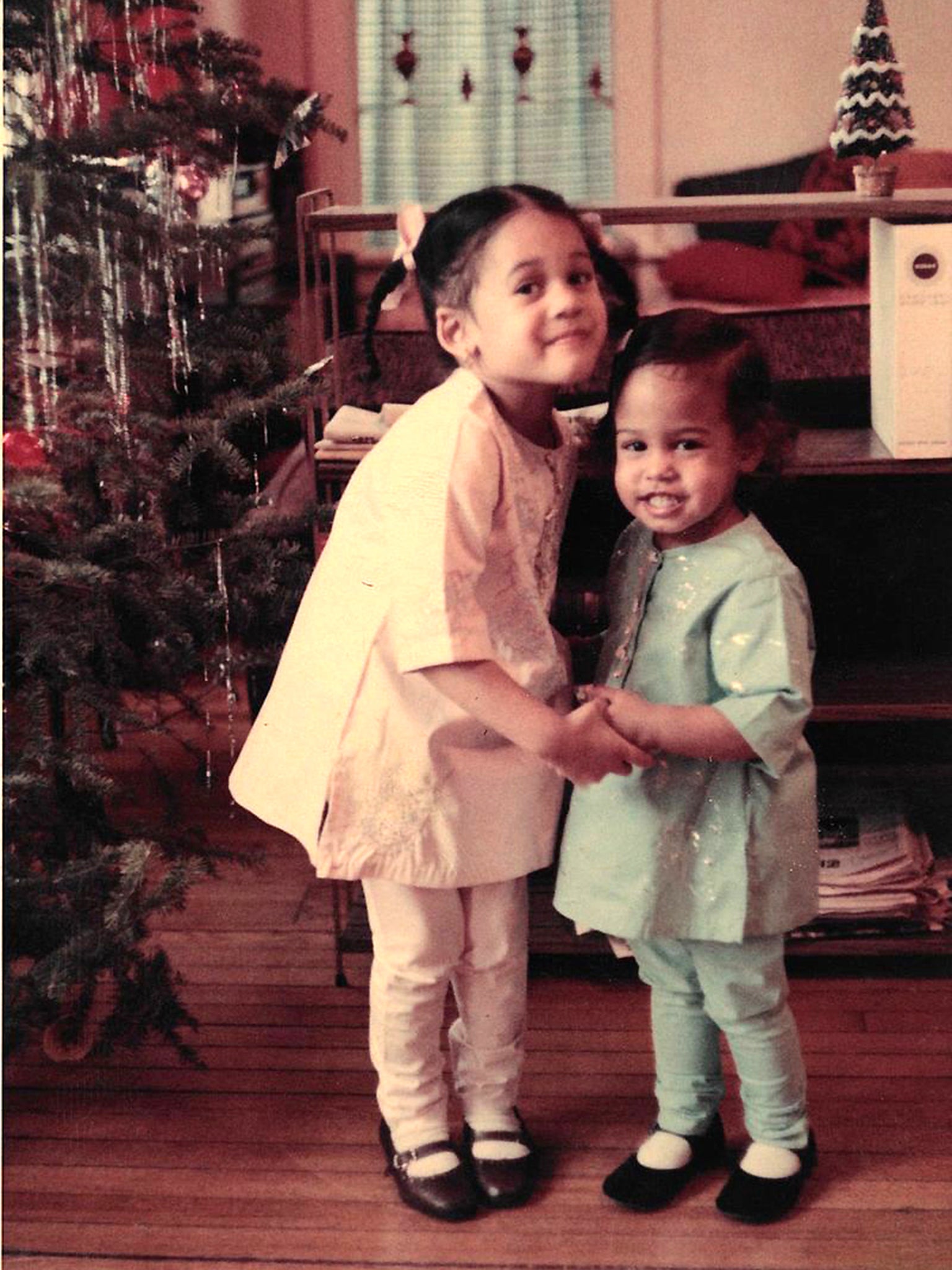 The Harris girls – Kamala, left, and Maya – pose for a Christmas photo in 1968