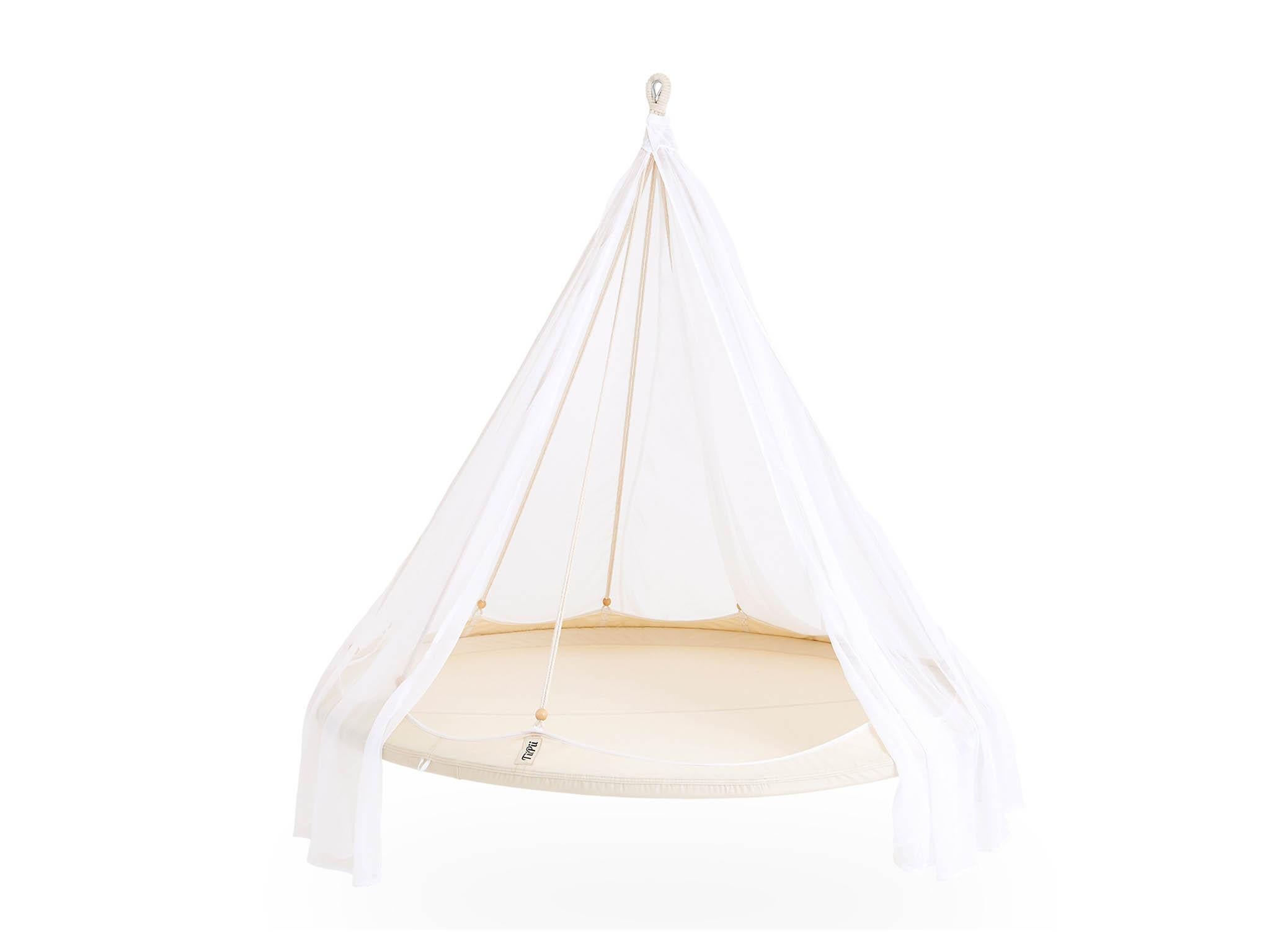 Kick back and relax in style with a cocktail in this hanging day bed (TiiPii)