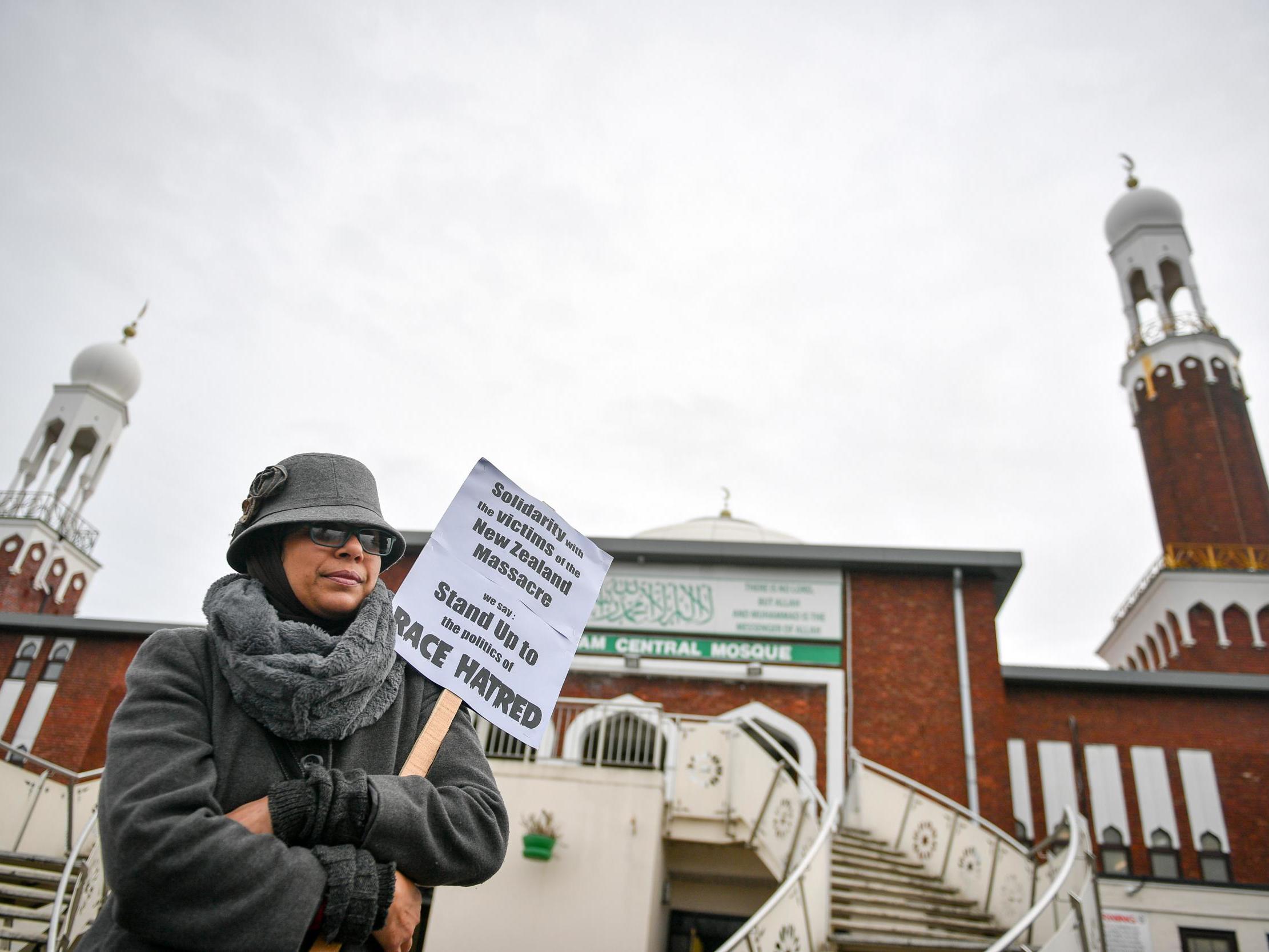 A woman stands outside Birmingham Central Mosque during Friday prayers in solidarity with victims of the Christchurch shooting earlier this year (PA)