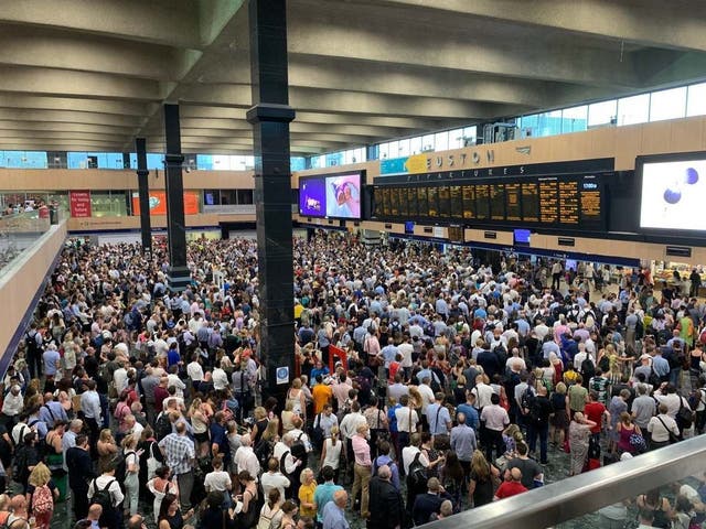 Crowds at Euston station in London, as commuters are enduring chaos and disruption on the railways as the UK swelters on its hottest July day on record